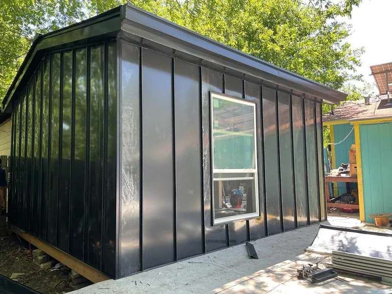 Black standing seam metal wall panels for Roof Inspection in Telford
